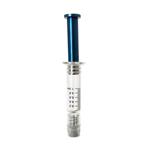 Blue colored metal plunger with gold plated tip inside a borosilicate glass syringe barrel with black graduation and gray luer lock tip