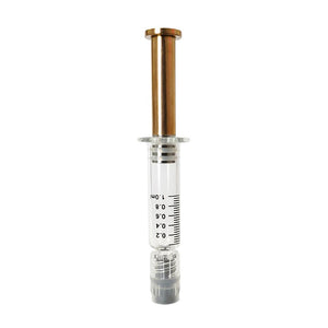 Rose Gold colored metal plunger with gold plated tip inside a borosilicate glass syringe barrel with black graduation and gray luer lock tip