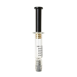 Black colored metal plunger with gold plated tip inside a borosilicate glass syringe barrel with black graduation and gray luer lock tip