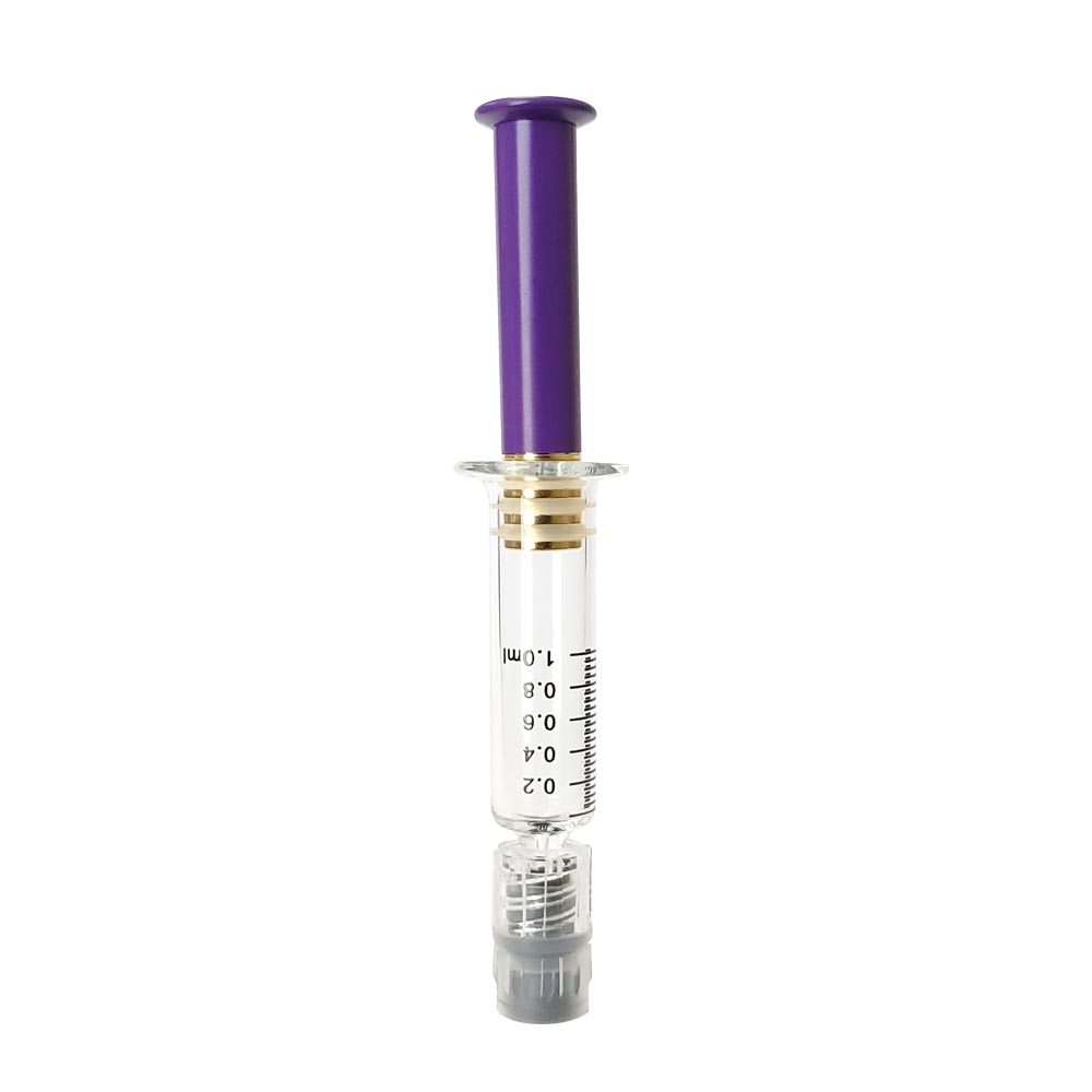 Purple colored metal plunger with gold plated tip inside a borosilicate glass syringe barrel with black graduation and gray luer lock tip