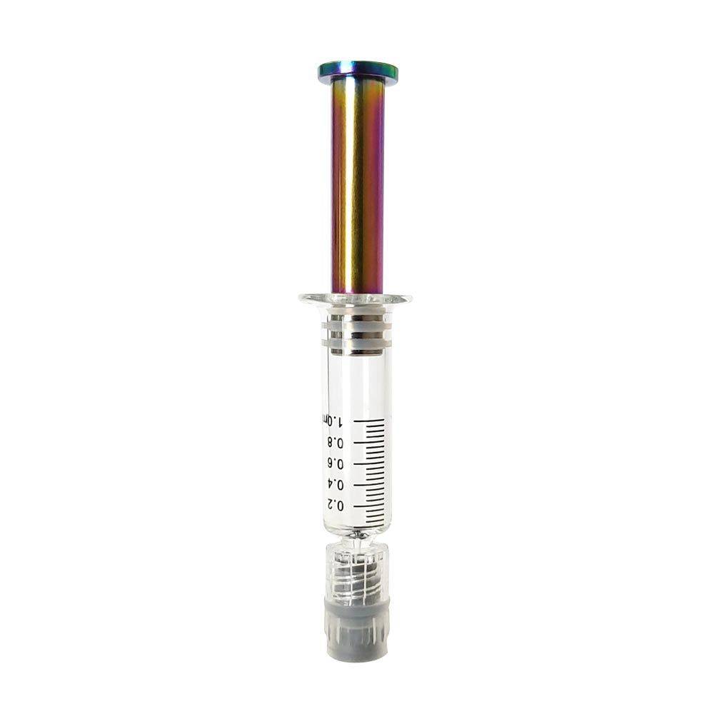 Rainbow colored metal plunger with gold plated tip inside a borosilicate glass syringe barrel with black graduation and gray luer lock tip