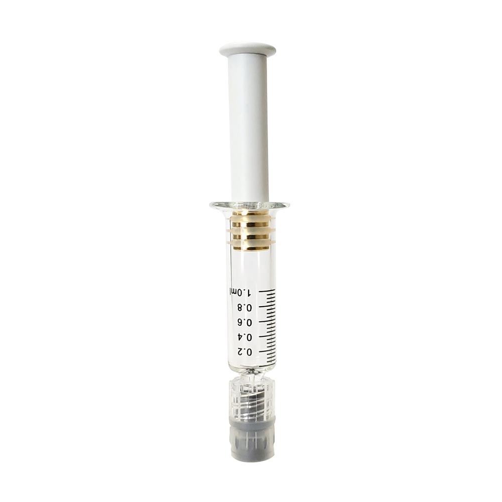 White colored metal plunger with gold plated tip inside a borosilicate glass syringe barrel with black graduation and gray luer lock tip